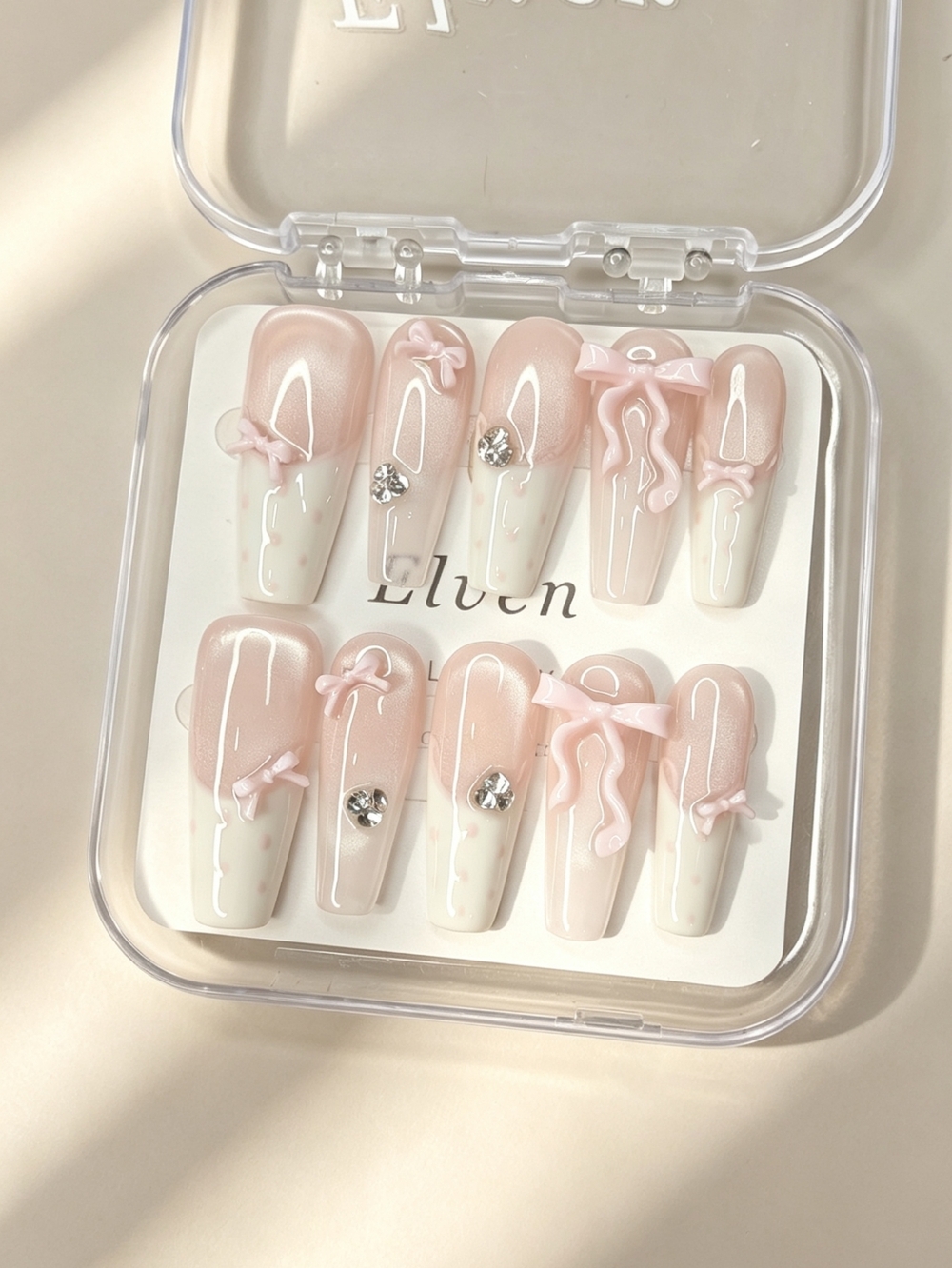 Elegant Pink Press-On Nails with Bow and Gem Accents Long Coffin